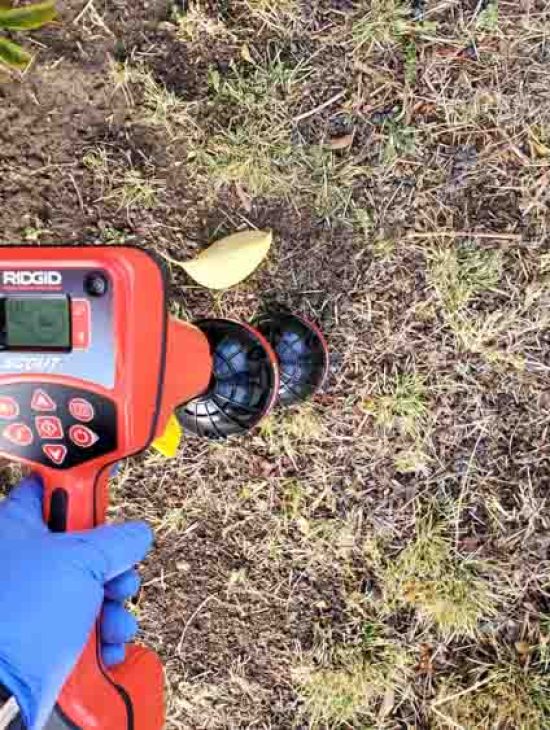 Precision Leak Detection Equipment Advanced leak detection equipment being used outdoors, highlighting the use of technology in modern plumbing diagnostics.